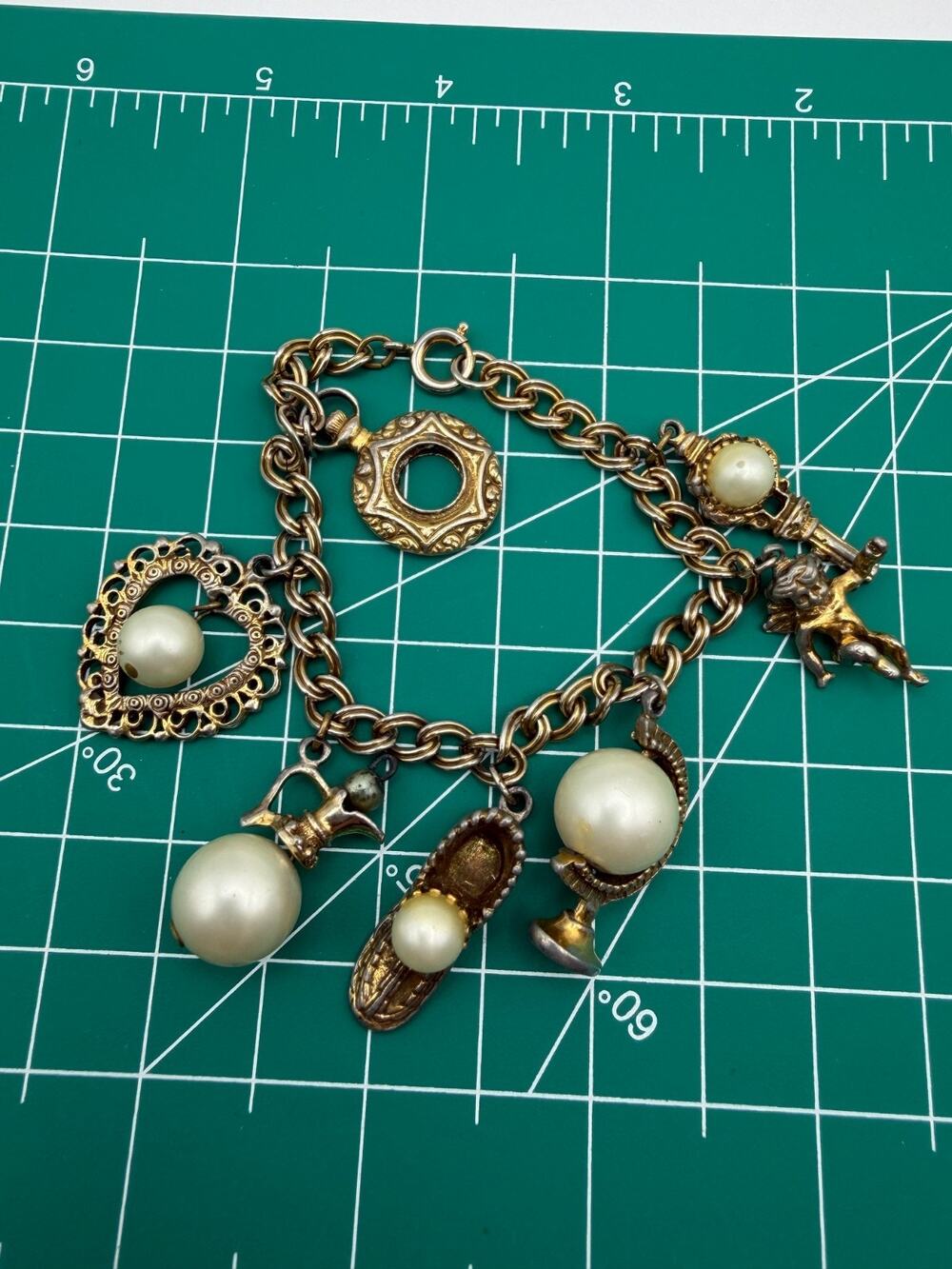 Vintage CIRCO Gold Tone Charm Bracelet Faux Pearl Cherub Key Globe Shoe Charms